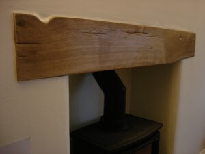 Reclaimed railway sleeper beam for a fire place